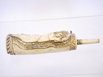 Lot 690 - Bone powder flask carved with a cherub holding...