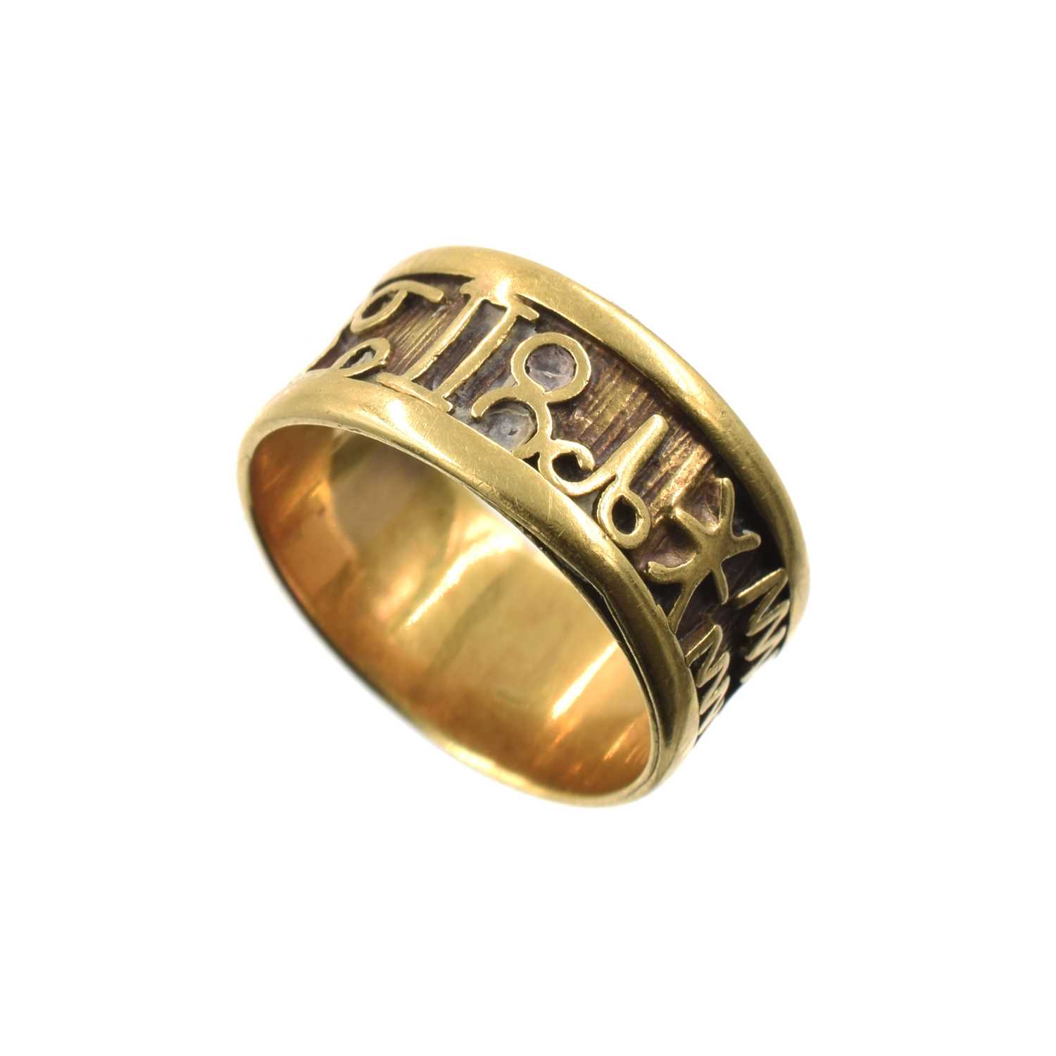 Lot A yellow metal zodiac ring