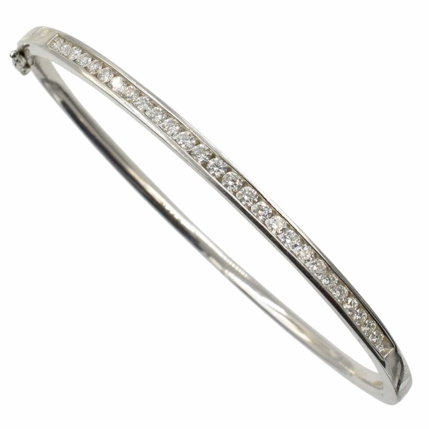 Lot An 18ct white gold and diamond bangle