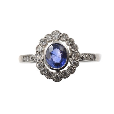 Lot 1 - A sapphire and diamond cluster ring