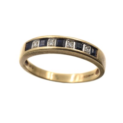 Lot 64 - A 9ct yellow gold sapphire and diamond ring