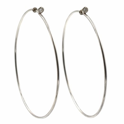 Lot A pair of silver Tiffany & Co. Elsa Peretti diamond-set hoop earrings
