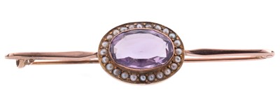 Lot 24 - A yellow gold amethyst and seed pearl brooch
