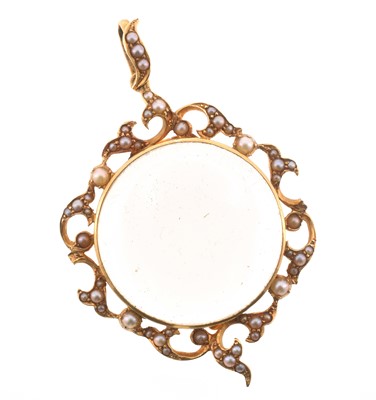 Lot 18 - A 15ct yellow gold and seed pearl rock crystal pendant