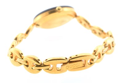 Lot 22 - A Gucci ladies 'Chameleon' gold plated quartz wristwatch set
