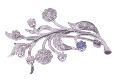 Lot 228 - A diamond and sapphire floral brooch