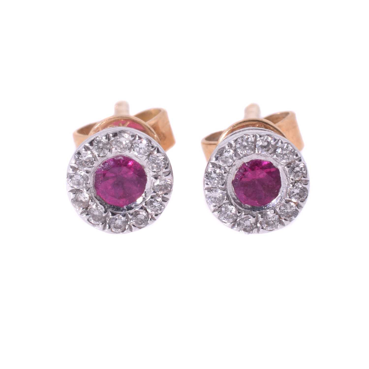 Lot 11 - A pair of 18ct ruby and diamond stud earrings