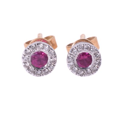 Lot 11 - A pair of 18ct ruby and diamond stud earrings