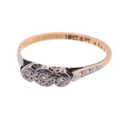 Lot 59 - A yellow metal three-stone diamond ring