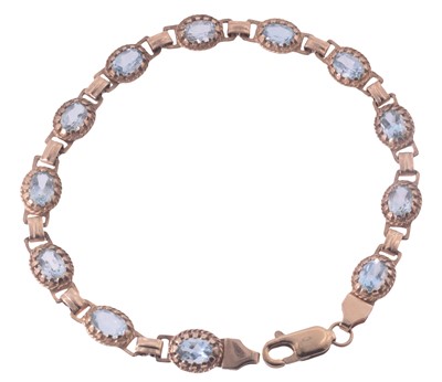 Lot 67 - A 9ct yellow gold and aquamarine bracelet