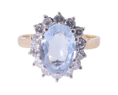Lot 28 - An 18ct yellow gold aquamarine and diamond ring