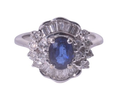 Lot 251 - An 18ct white gold sapphire and diamond ring