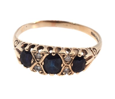 Lot 167 - A 9ct yellow gold diamond and sapphire ring