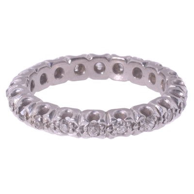 Lot 54 - A white metal eternity ring