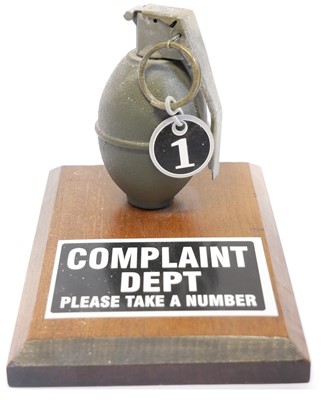 Lot Complaints department inert hand grenade desk...