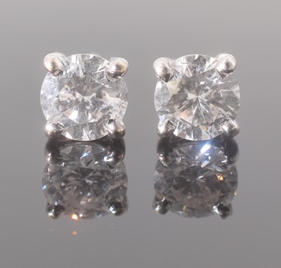 Lot 131 - A pair of 18ct white gold diamond earrings.