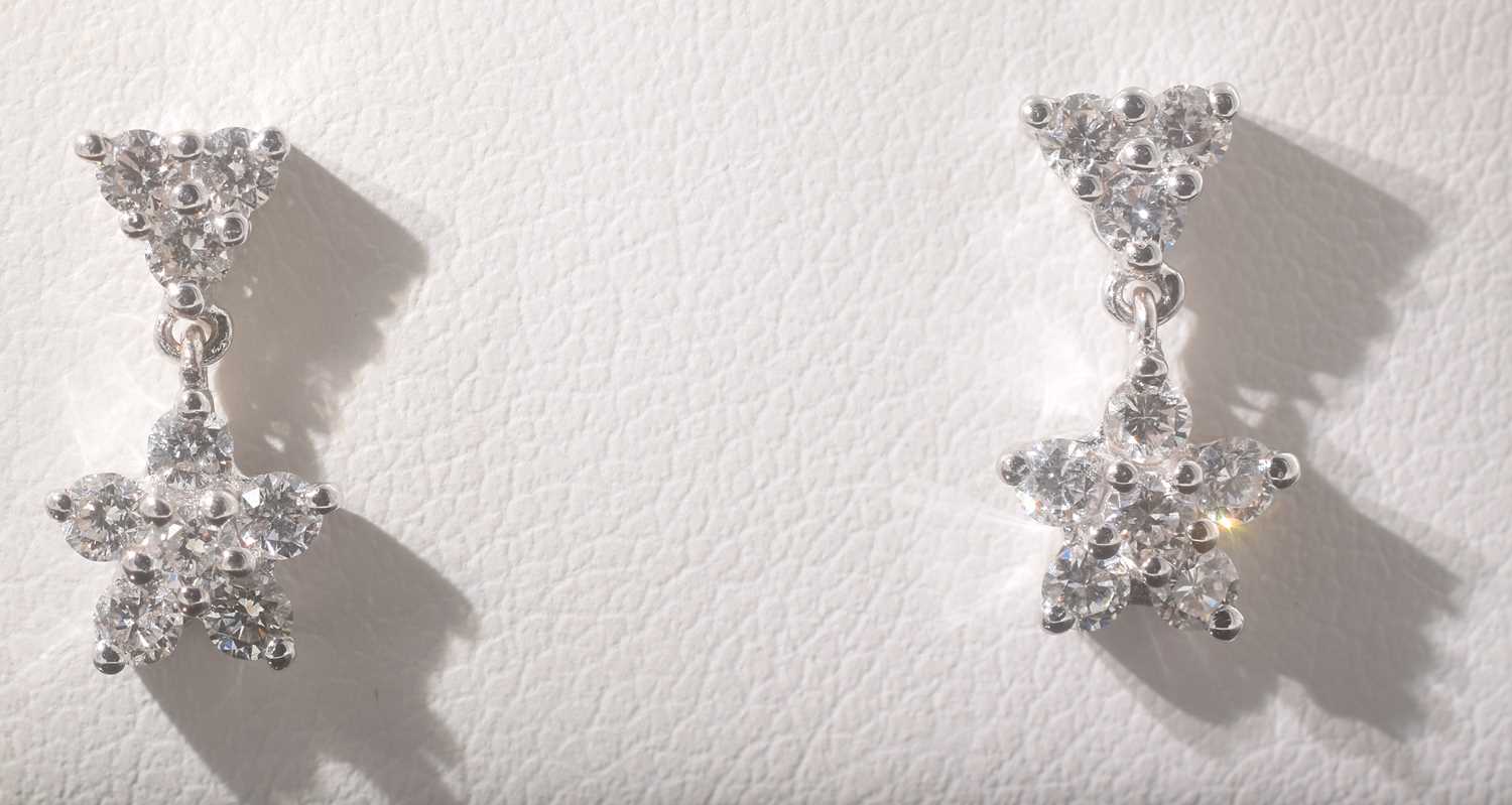 Lot 25 - A pair of 18ct white gold diamond drop earrings