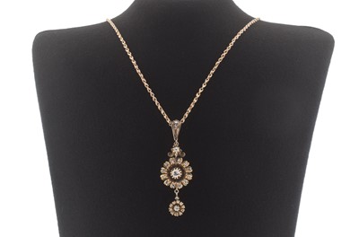 Lot 242 - A rose metal and diamond pendant necklace