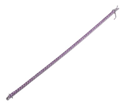 Lot 277 - An 18ct white gold and pink sapphire tennis bracelet