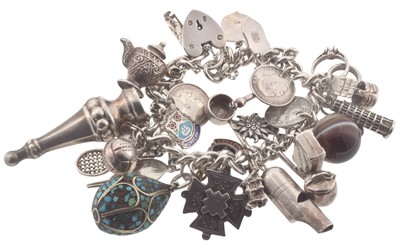 Lot 253 - A silver charm bracelet