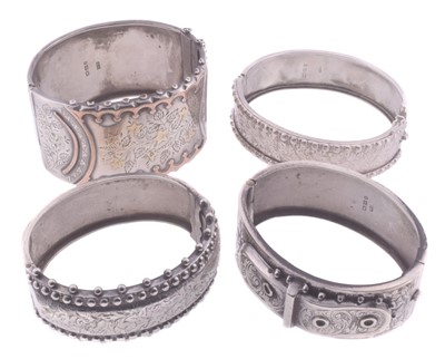 Lot 62 - A group of four silver hinged bangles