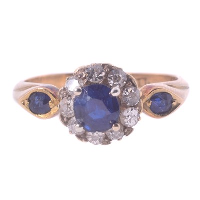 Lot 49 - An 18ct yellow gold diamond and synthetic sapphire ring