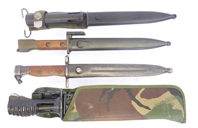 Lot Four bayonets and scabbards, to include an...