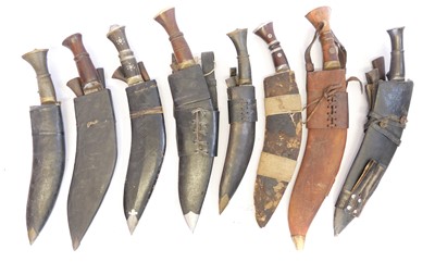 Lot Eight Kukris and scabbards, two with spurious...