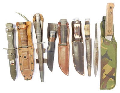 Lot Eight varous knives and scabbards, including a...