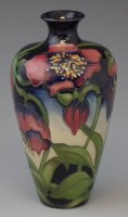 Lot 251 - Moorcroft red helibore vase boxed.