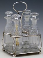 Lot 298 - Four bottle silver cruet.
