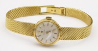 Lot 384 - Omega 18k gold lady's bracelet watch, cal 245.