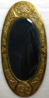 Lot 622 - Scottish School Arts and Crafts brass mirror.