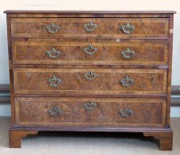 Lot 648 - Walnut chest of drawers.