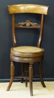 Lot 695 - Rosewood piano stool.