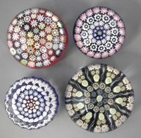 Lot 79 - Three Perthshire paperweights and a Peter