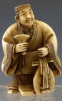 Lot 200 - Japanese ivory netsuke of a musician.