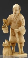 Lot 202 - Japanese ivory okimono of a farmer.