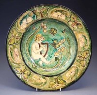 Lot 188 - Della Robbia charger,  decorated with a cherub