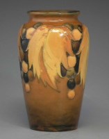Lot 201 - Moorcroft leaf and berry vase.