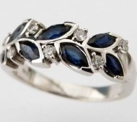 Lot 253 - 18ct white gold diamond and sapphire half hoop