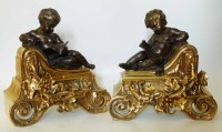 Lot 511 - Pair of gilt metal cherub chenets