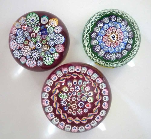 Lot 82 - Three John Deacons glass paper weights.