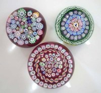 Lot 82 - Three John Deacons glass paper weights.