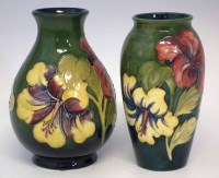Lot 243 - Two Moorcroft vases,   decorated with hibiscus
