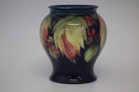 Lot 244 - Moorcroft vase,   decorated with leaves and