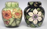 Lot 277 - Two Moorcroft ginger jars and covers,   to