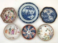 Lot 354 - Three Chinese saucers, two teapot stands, and a