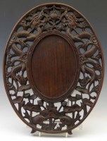 Lot 404 - Chinese carved rosewood oval frame.