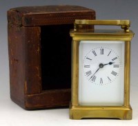 Lot 703 - Brass carriage clock in carrying case.
